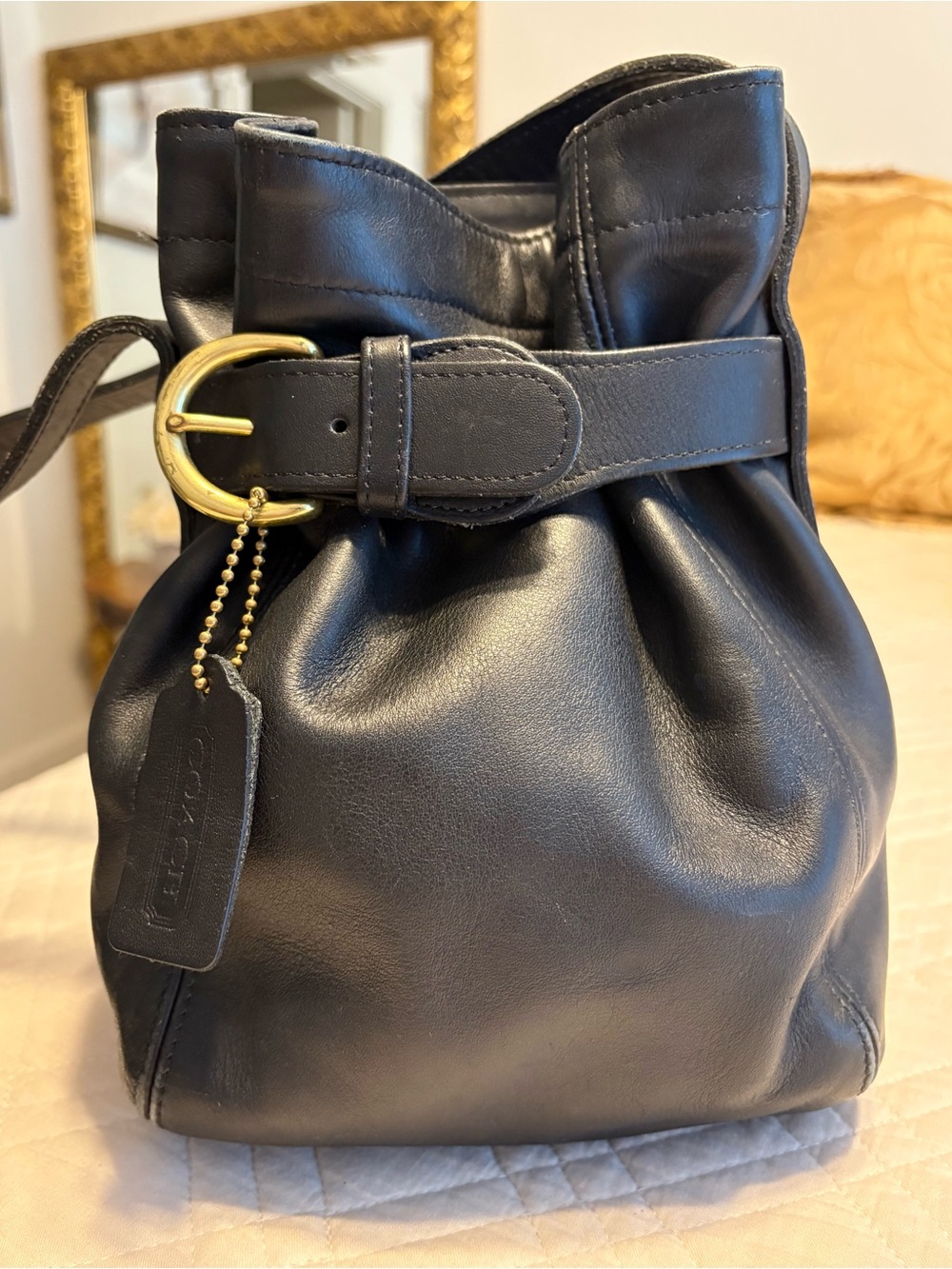 Coach Black Leather Drawstring Bucket Bag with Gold Buckle Accent